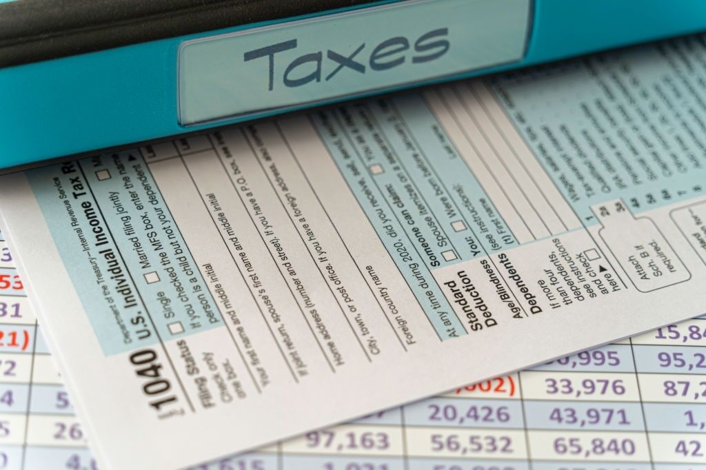 United states tax form on spreadsheet with file – Tax Preparation concept